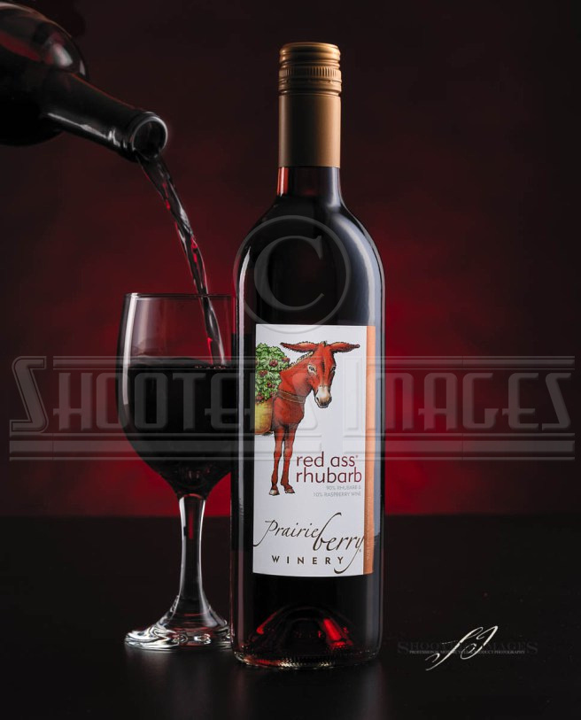 A product shoot of Red Ass wine from Prairie Berry Winery.